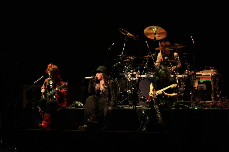 Band Performing on Stage — Black, Dramatic, Night, Photograph, Drums