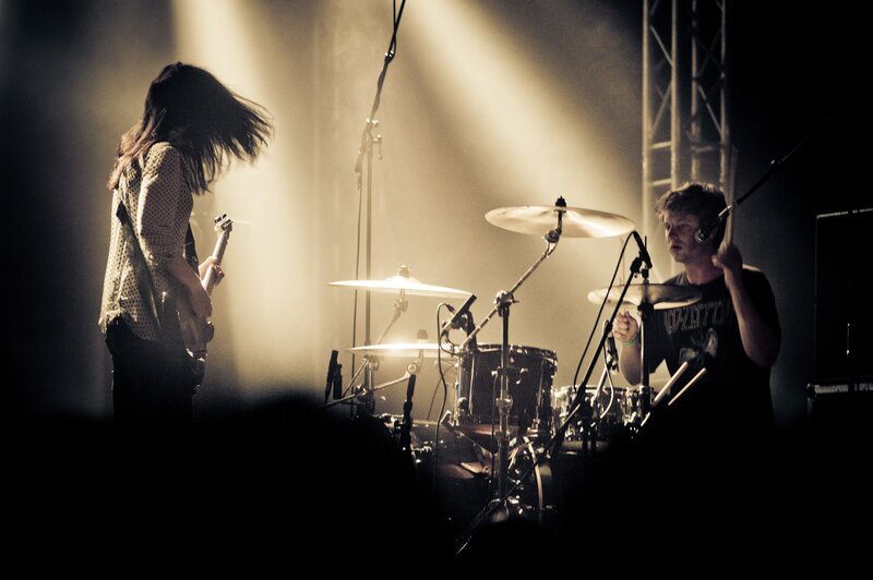 Band Performing on Stage — Black, Dramatic, Night, Photograph, Guitarist, Drummer, Drum Kit
