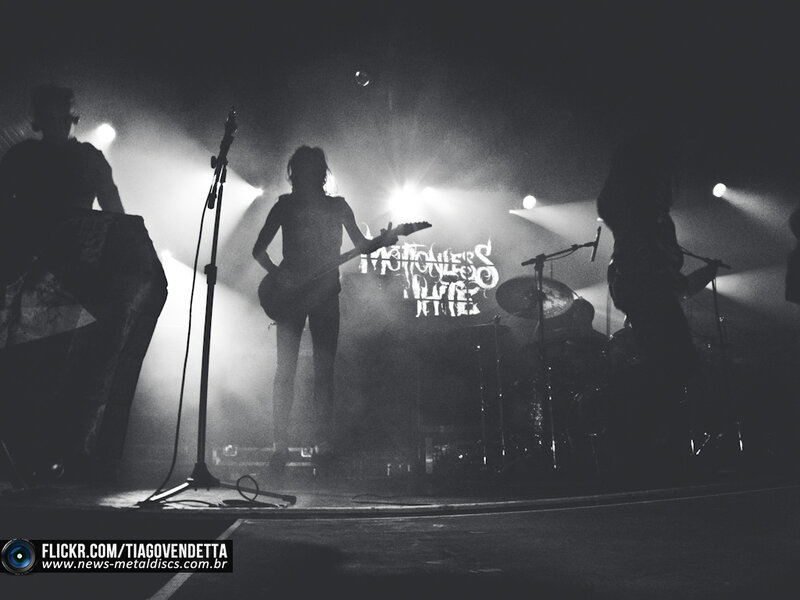 Band Performing on Stage — Black, Dramatic, Night, Photograph, Guitarist, Drummer, Microphone