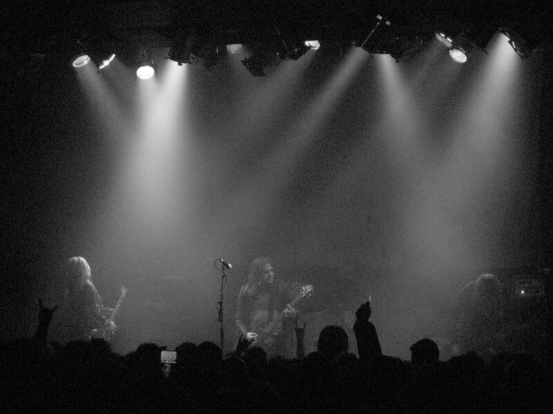 Band Performing on Stage — Black, Dramatic, Night, Photograph, Guitarists, Audience, Spotlights