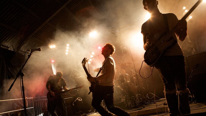Band Performing on Stage — Black, Dramatic, Night, Photograph, Guitarists