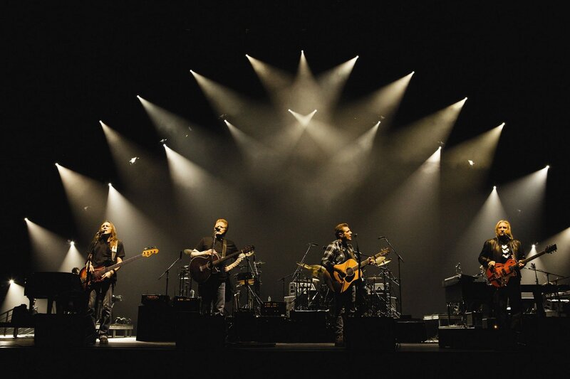 Band Performing on Stage — Black, Dramatic, Night, Photograph, Guitars