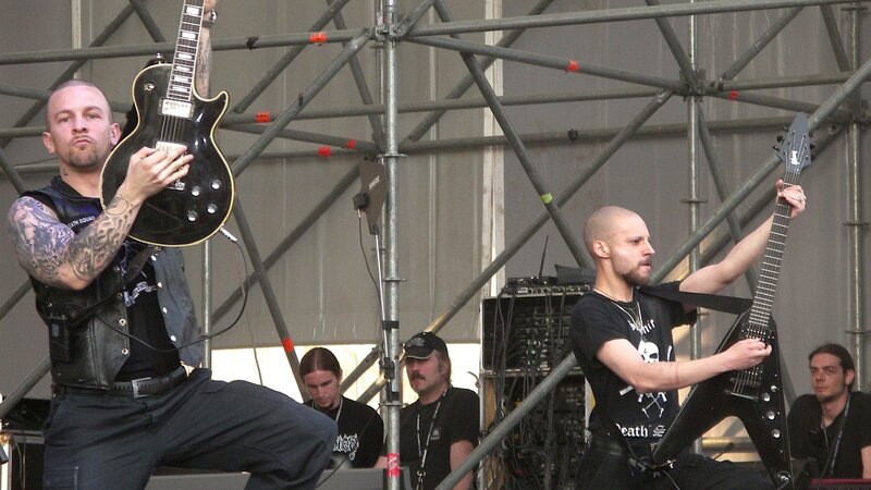 Band Performing on Stage — Black, Energetic, Afternoon, Photograph, Guitarists