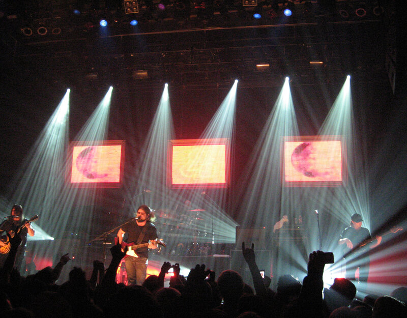 Band Performing on Stage — Black, Energetic, Night, Photograph, Audience, Spotlights
