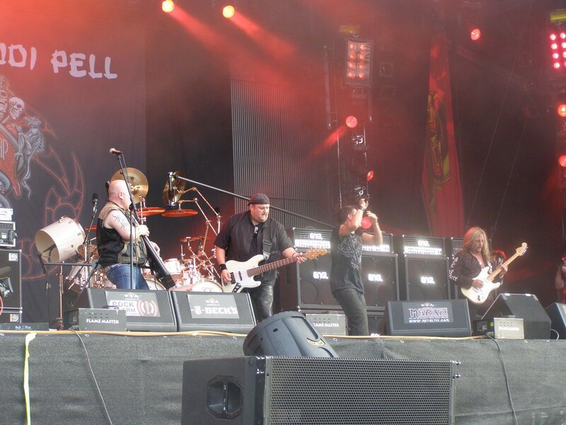 Band Performing on Stage — Black, Energetic, Night, Photograph, Drums