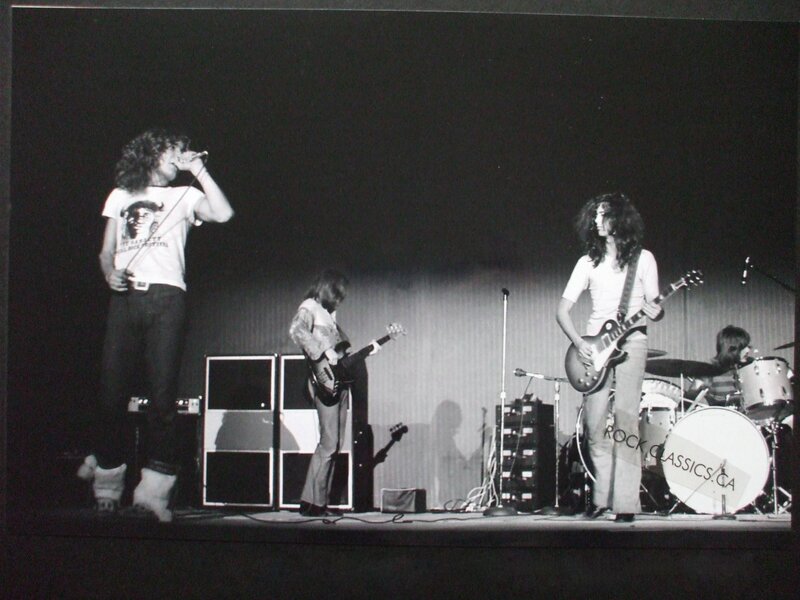 Band Performing on Stage — Black, Energetic, Night, Photograph, Guitar, Drums, Microphone, White