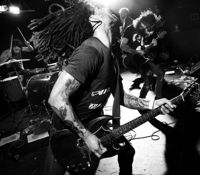 Band Performing on Stage — Black, Energetic, Night, Photograph, Guitar, Drums, Tattoos