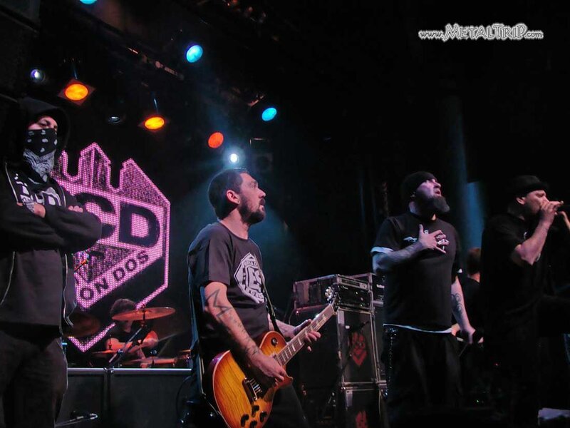 Band Performing on Stage — Black, Energetic, Night, Photograph, Guitar, Drums