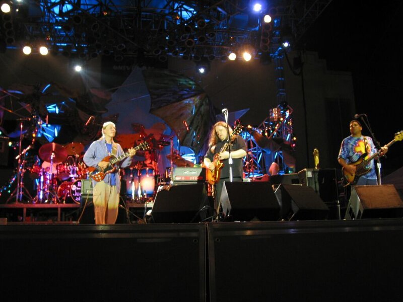 Band Performing on Stage — Black, Energetic, Night, Photograph, Guitarists