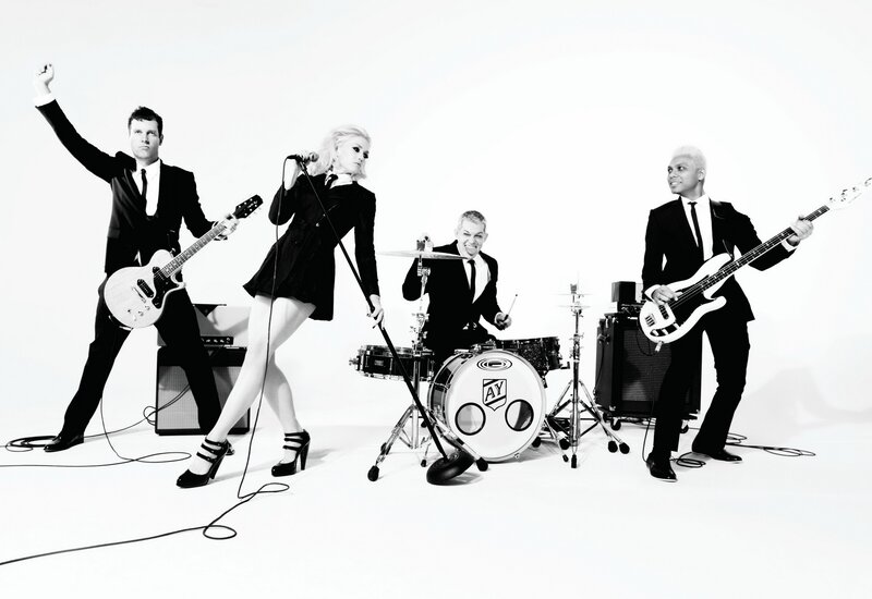 Band Performing on Stage — Black, Energetic, Photograph, Guitar