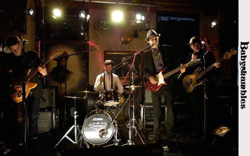 Band Performing on Stage — Black, Lively, Night
