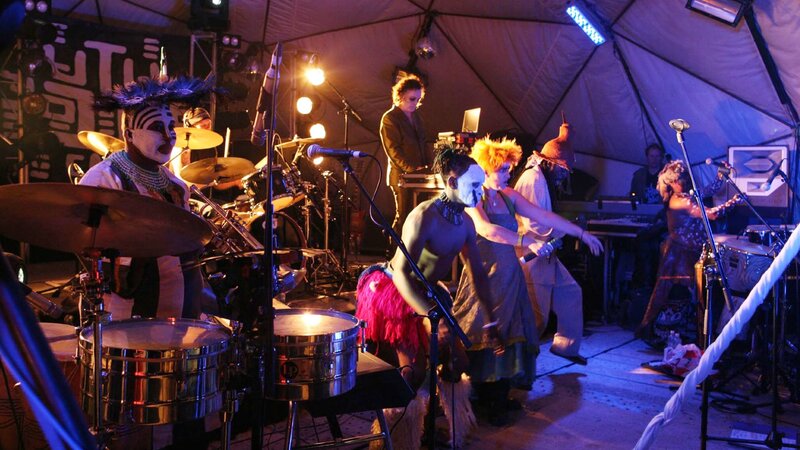Band Performing on Stage — Blue, Energetic, Night, Photograph, Drums