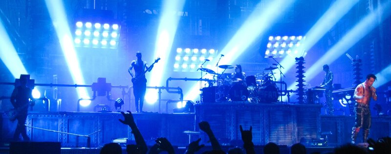Band Performing on Stage — Blue, Energetic, Night, Photograph, Guitarist