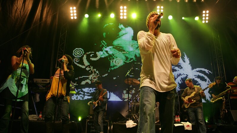 Band Performing on Stage — Green, Energetic, Night, Photograph