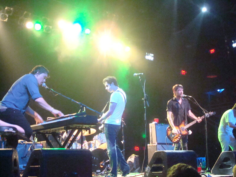 Band Performing on Stage — Green, Energetic