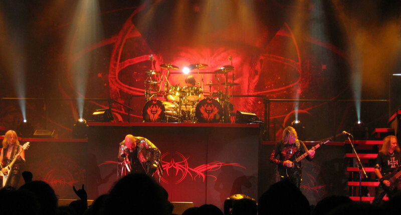 Band Performing on Stage — Red, Dramatic, Night, Photograph, Guitarists, Drummer