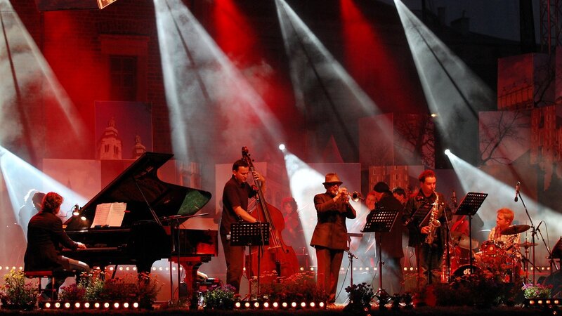 Band Performing on Stage — Red, Dramatic, Night, Photograph