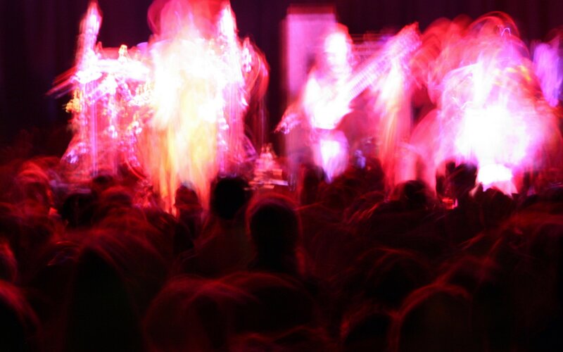 Band Performing on Stage — Red, Energetic, Night, Photograph