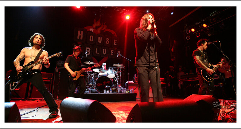 Band Performing on Stage — Red, Energetic, Night