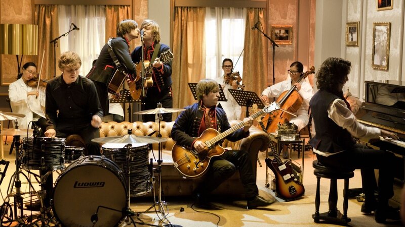 band performing with orchestra