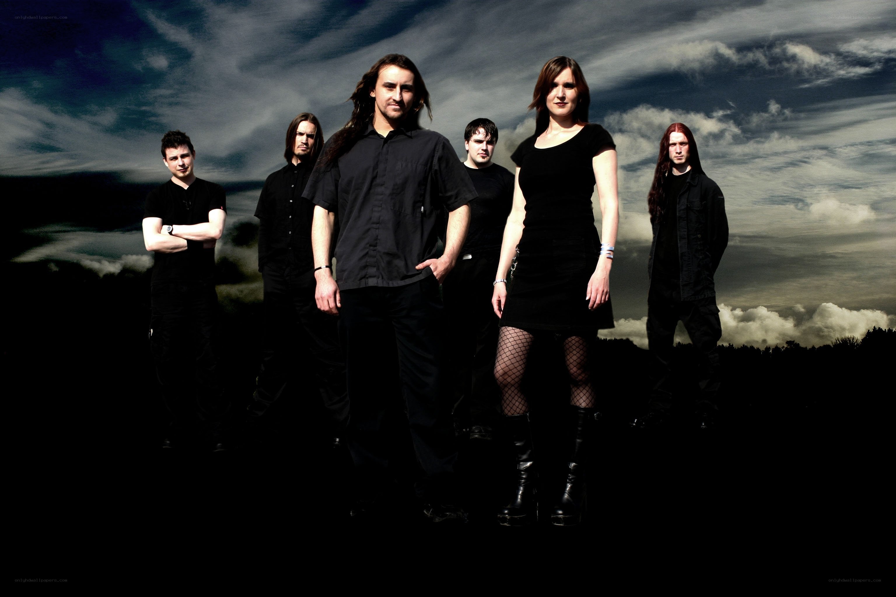band photo against cloudy sky