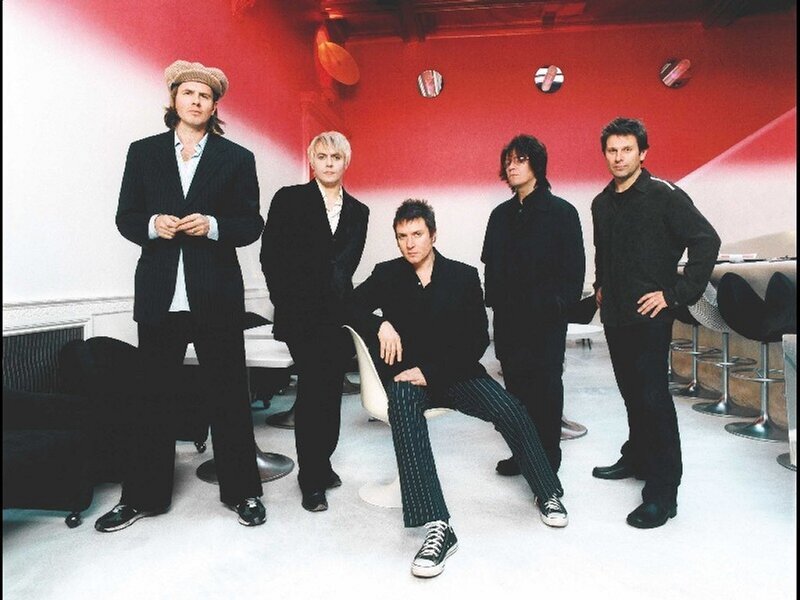band photo in red room