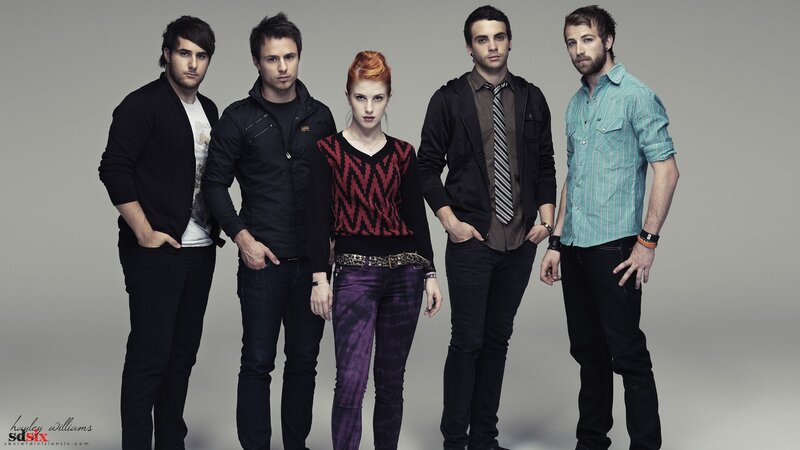 band photo of five members