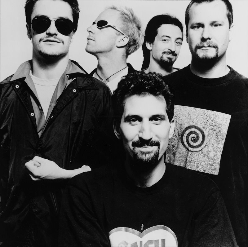 band photo of five men