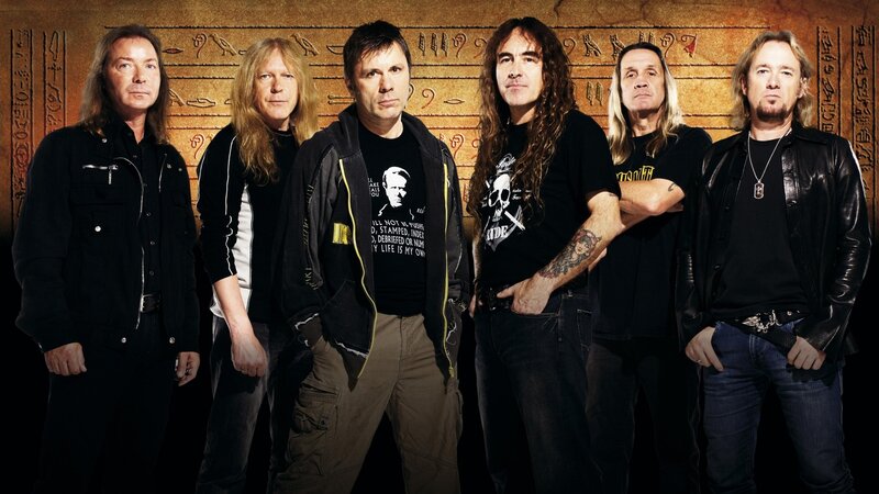 band photo with ancient backdrop
