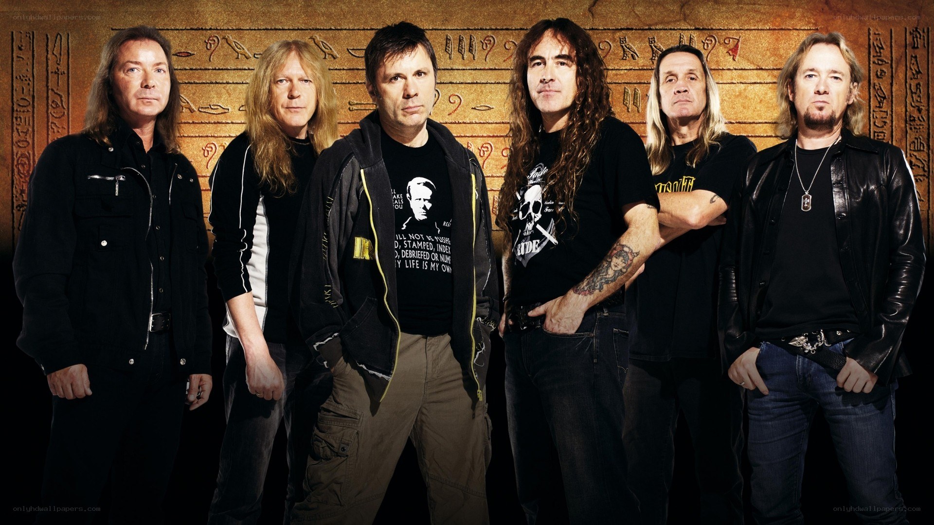band photo with ancient backdrop