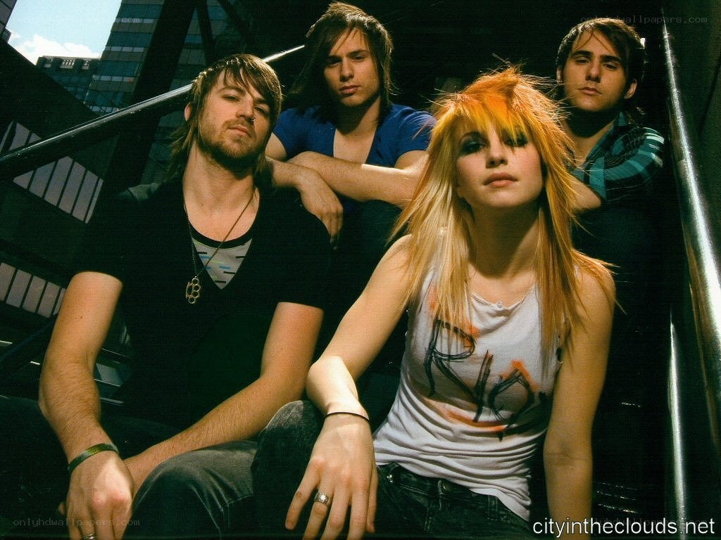 band photo with city backdrop
