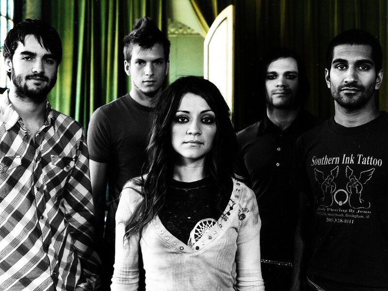 band photo with green curtain