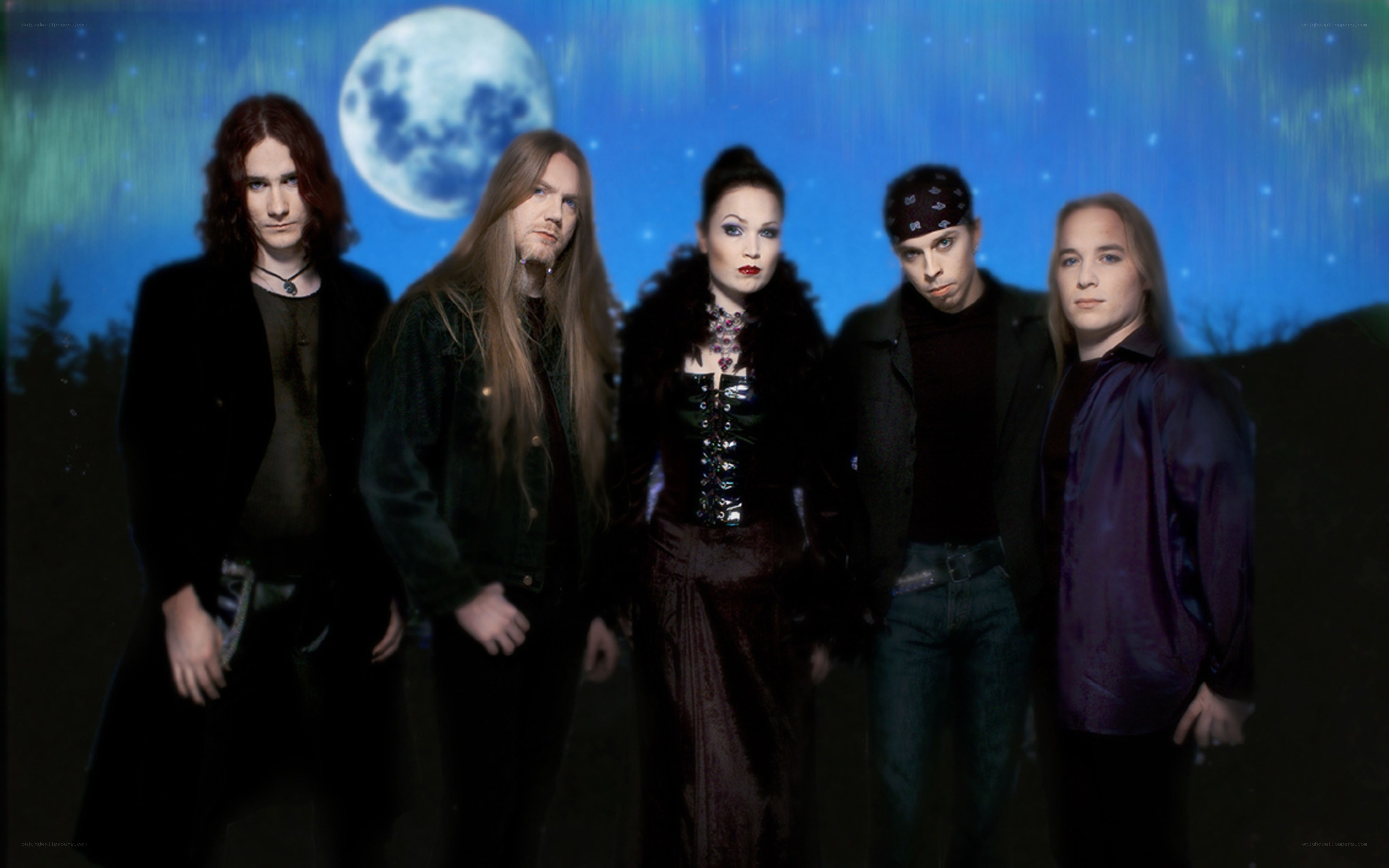 band photo with moon backdrop