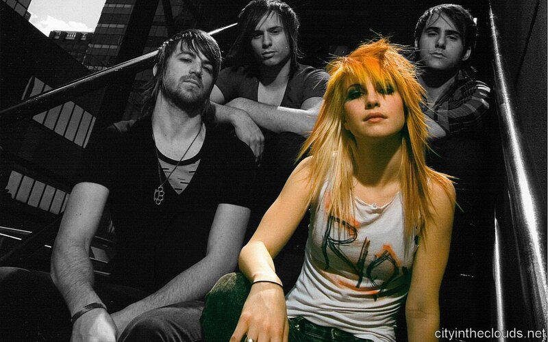 band photo with one member in color