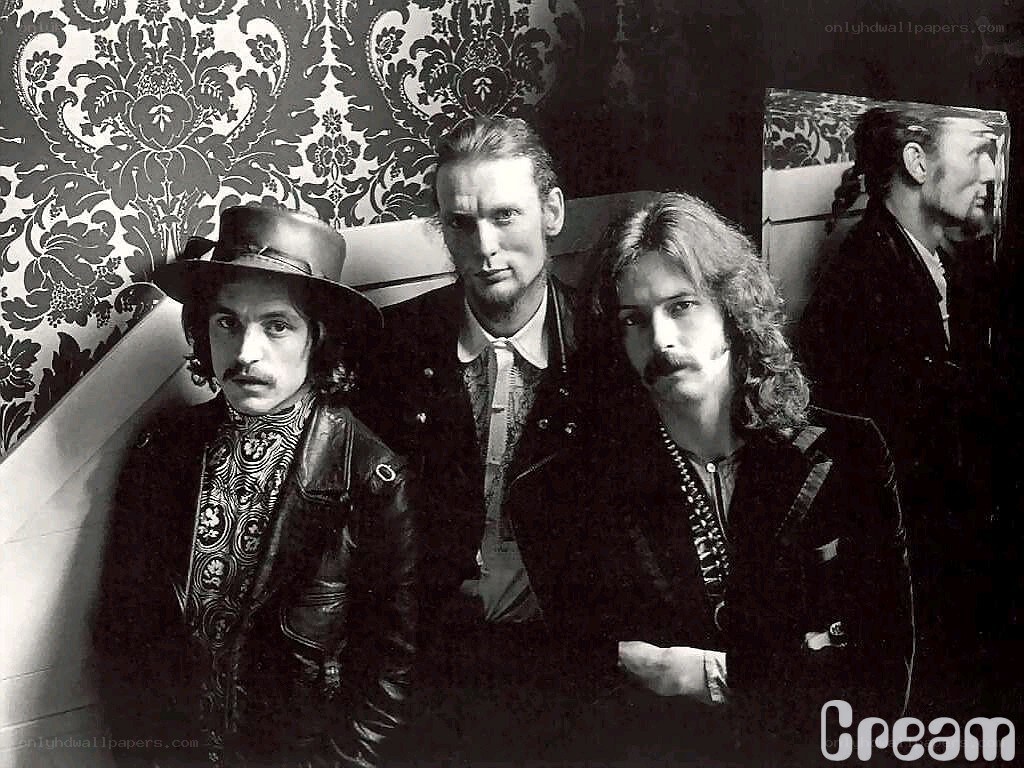 band photo with patterned wallpaper