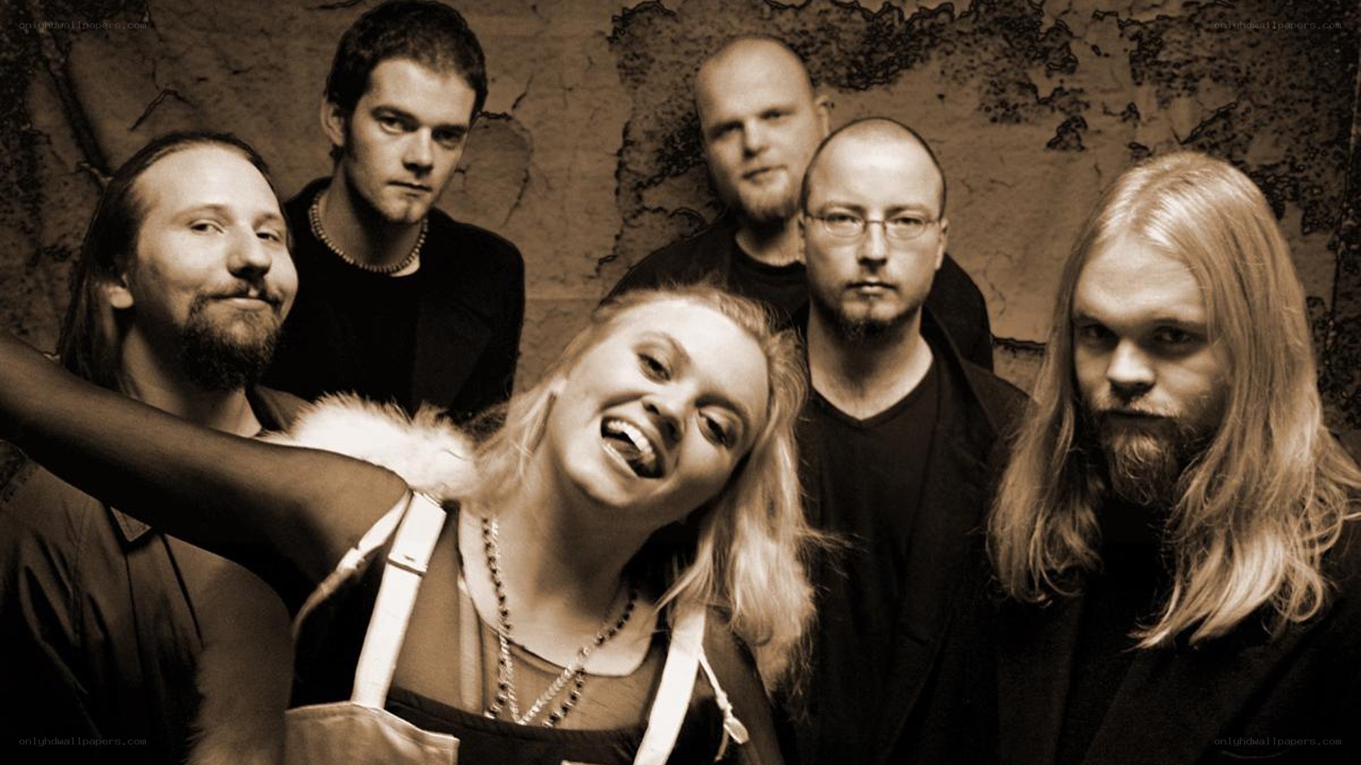 band photo with smiling woman