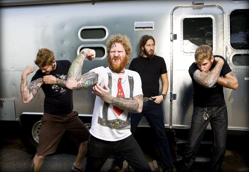 band posing by trailer