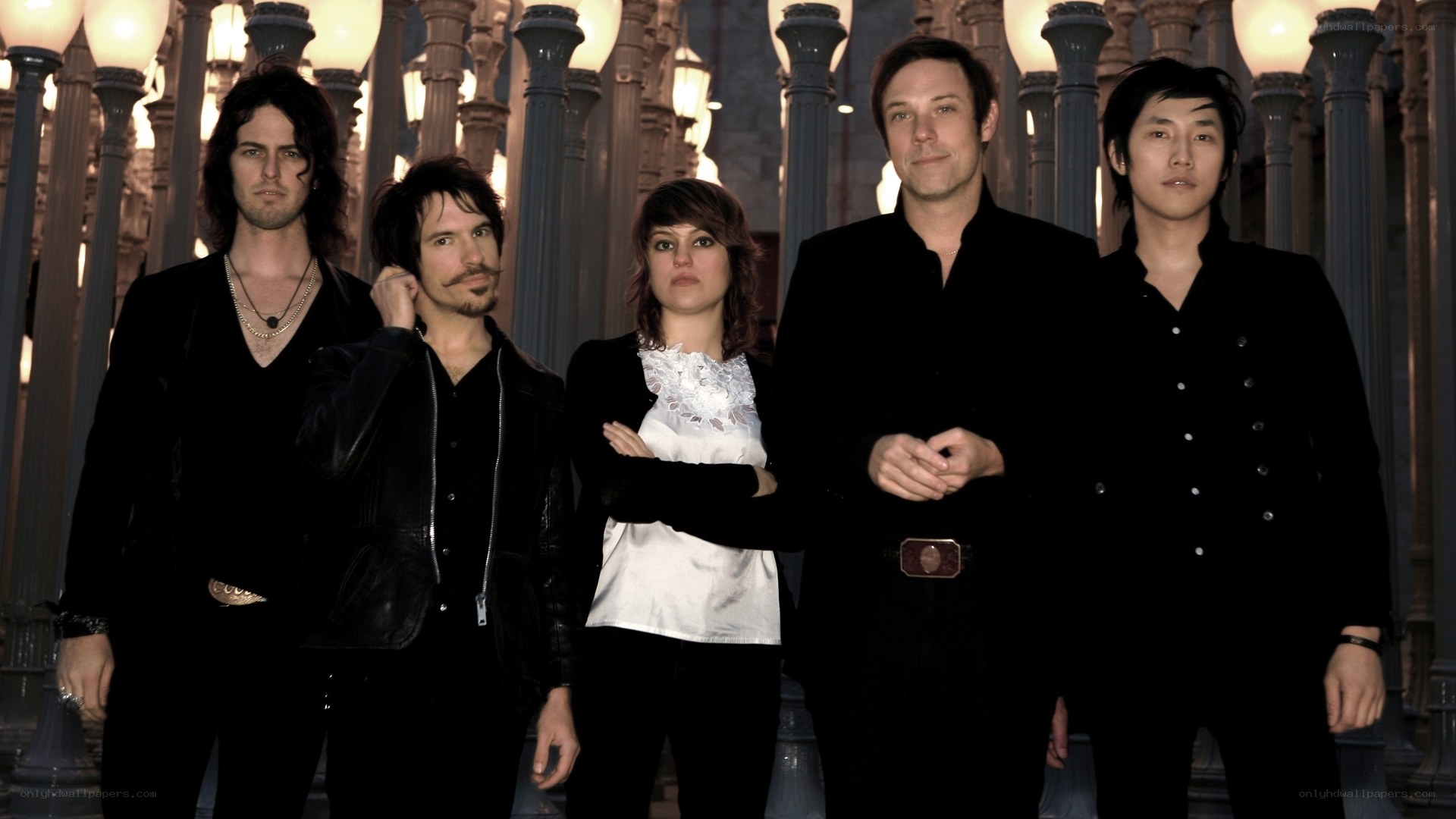 band posing in a columned hall