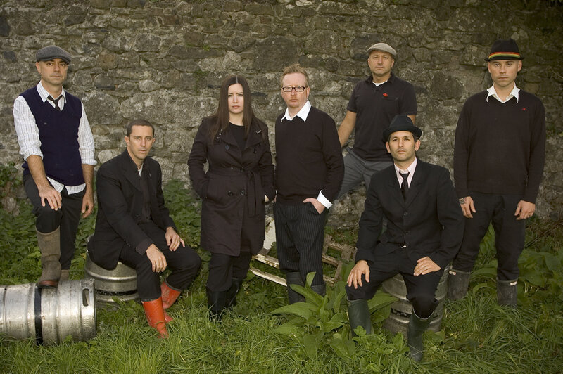 band posing in a field