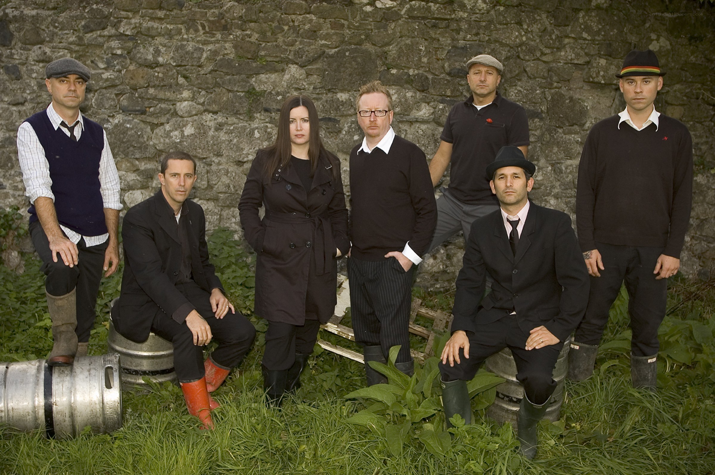 band posing in a field