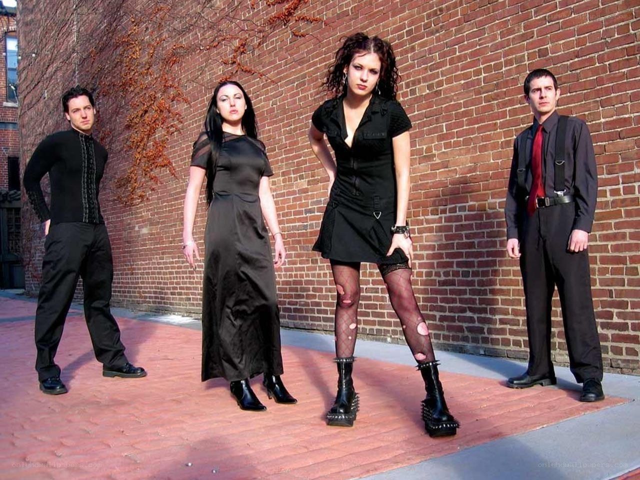 band posing in black attire