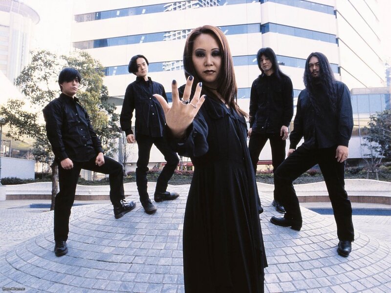 band posing in black