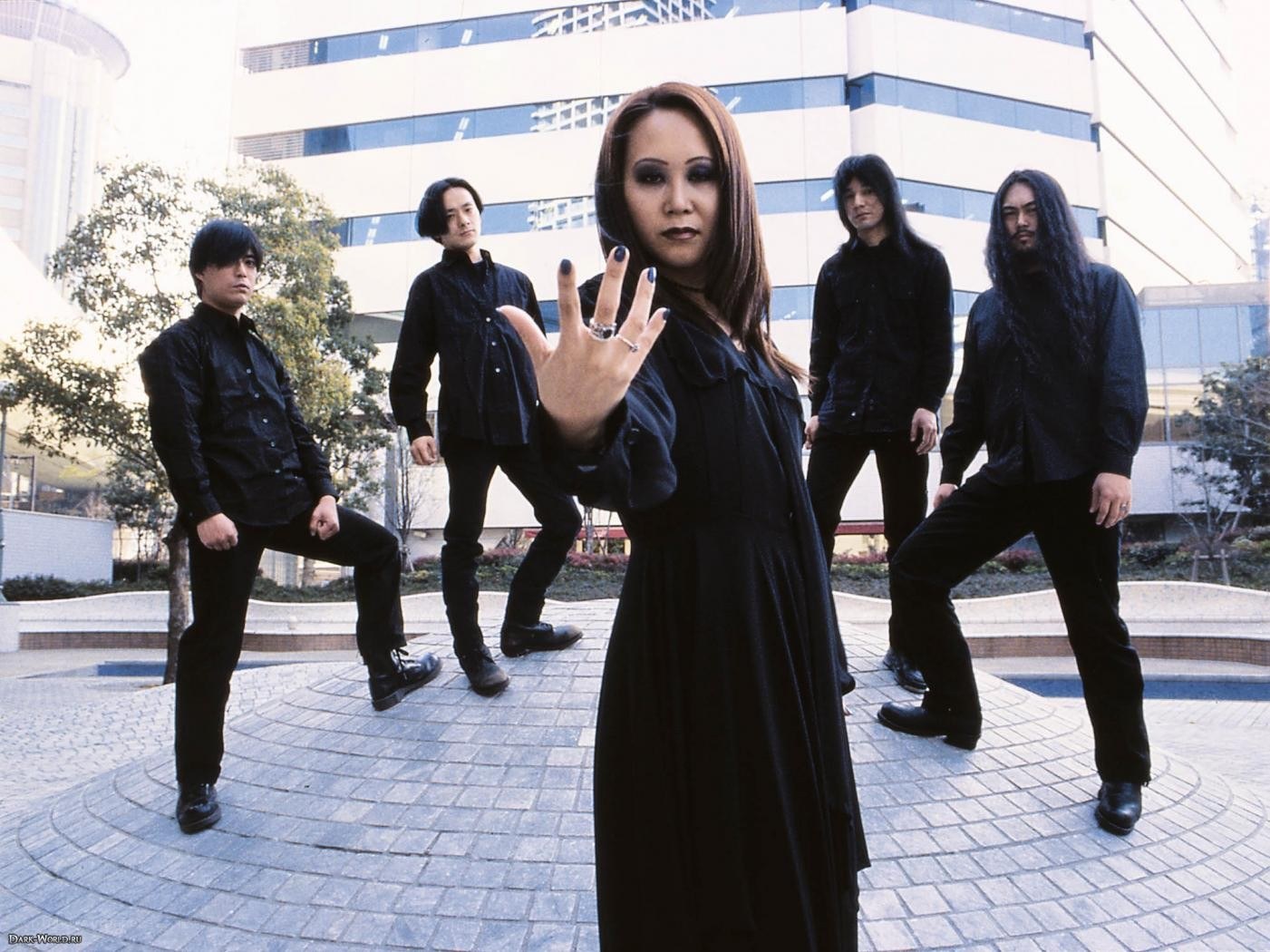 band posing in black
