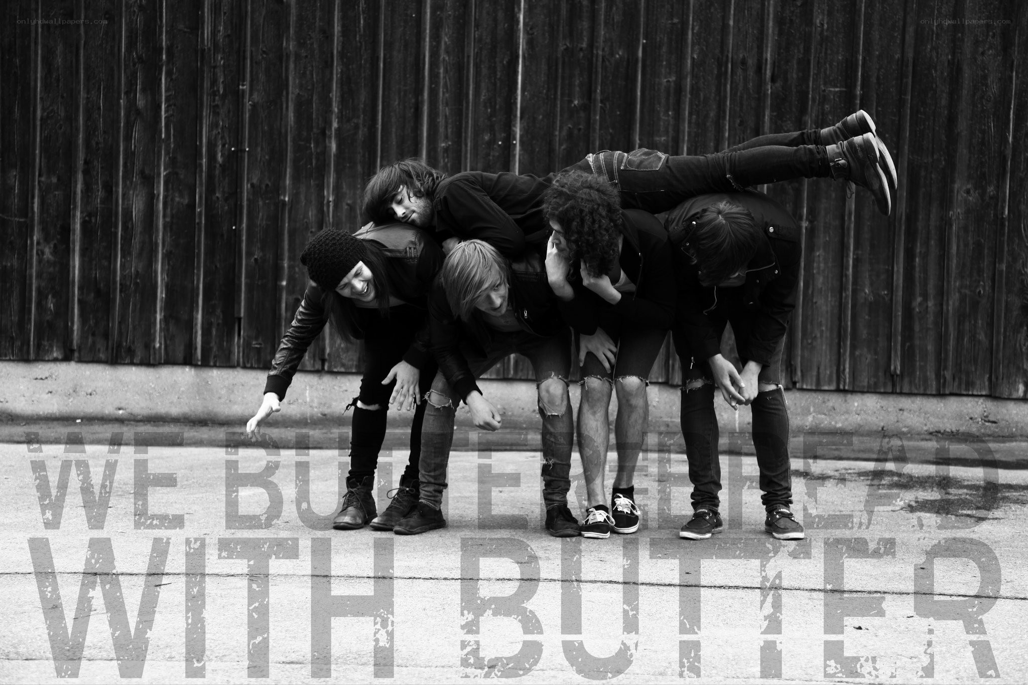 band posing in human pyramid