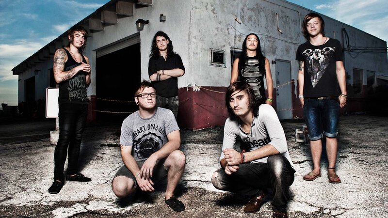 band posing in industrial area