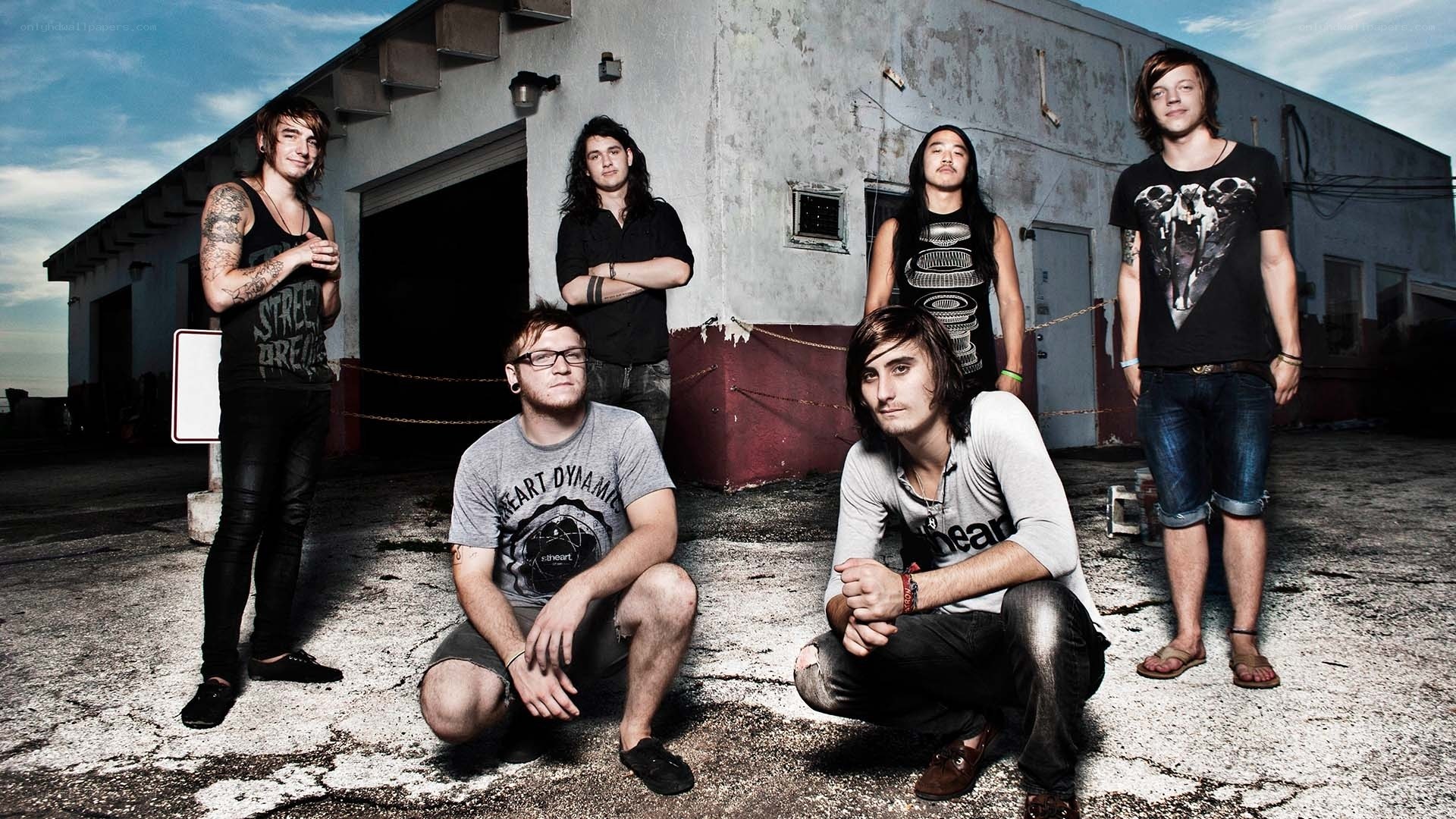 band posing in industrial area