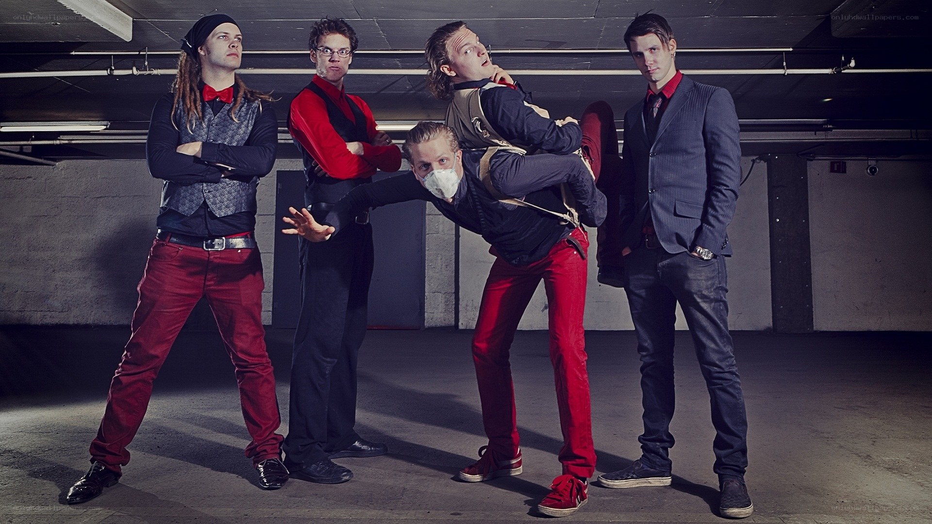 band posing in parking garage