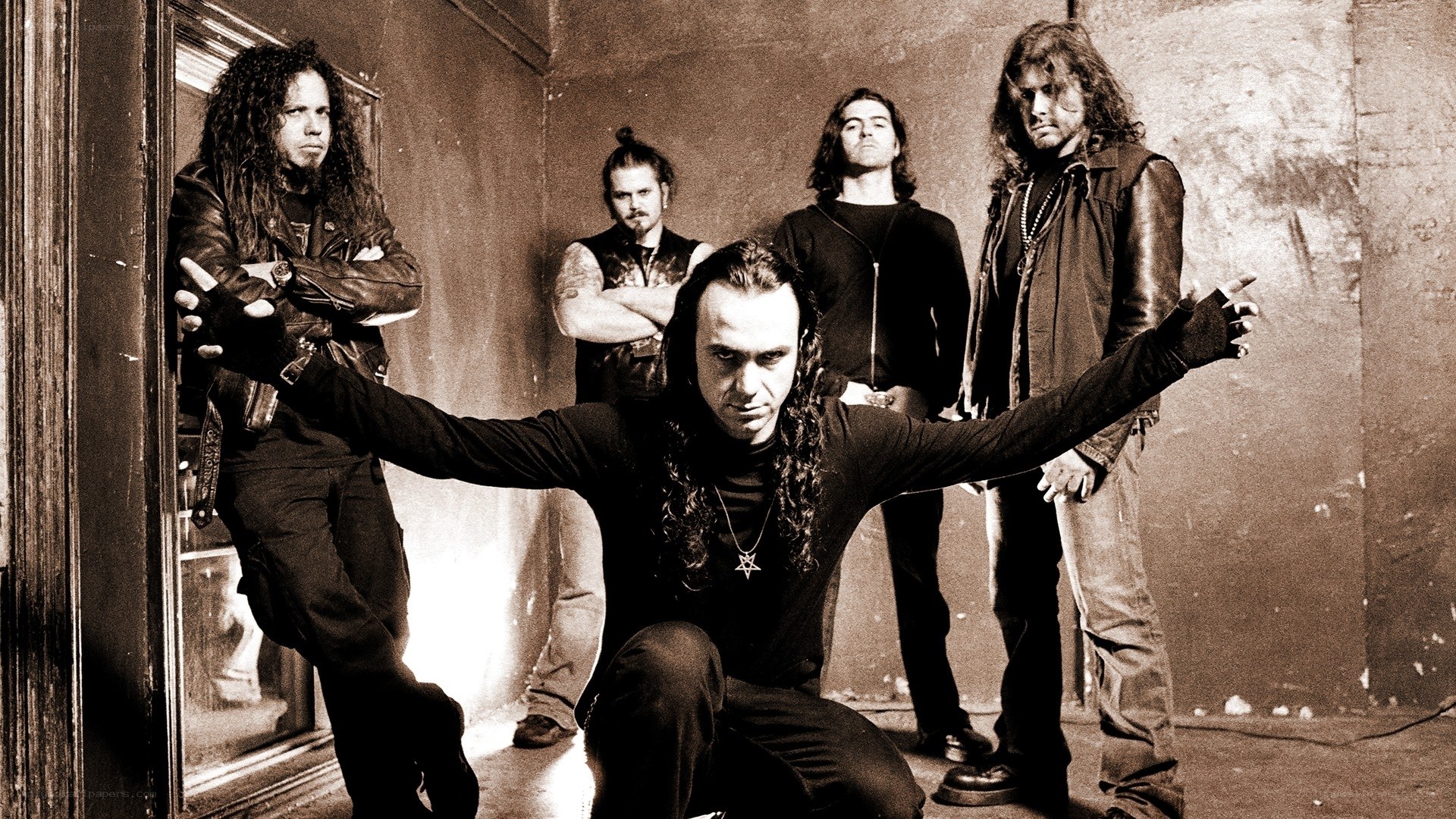 band posing in sepia