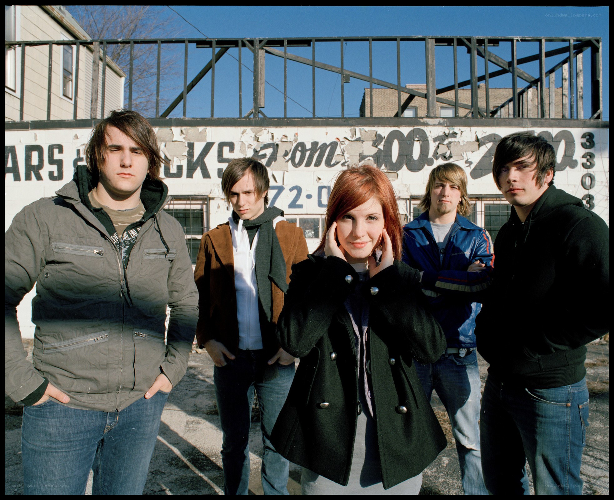 band posing in urban setting