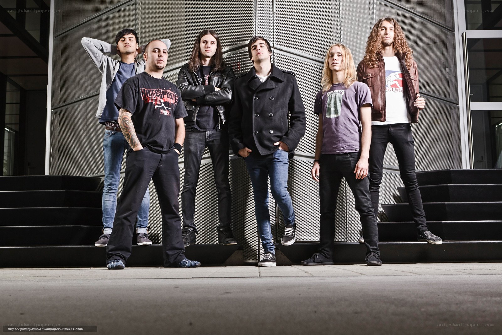 band posing on steps